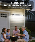 Installed Crazy Bright 24W LED Shop Lights 5400 Lumens 6000K Daylight White illuminates garage during family barbecue