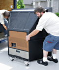 Two men using Beast Of A Heavy Duty Furniture Dolly With Reinforced Steel Frame 2200 Lbs Capacity Four Wheel Cart With Brakes outdoors