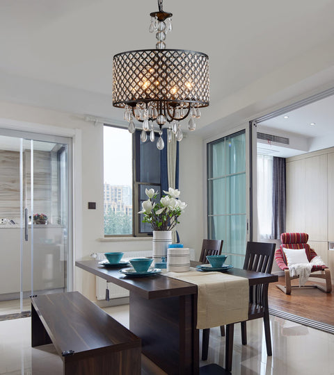 Antique Black Hanging Pendant Light With Crystal Drum Shade installed above dining table, modern vintage glow.