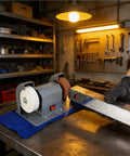 Heavy Duty Electric Knife Sharpener With Slick Variable Speed Control And Dual Sharpening Stone Setup on workbench in workshop.