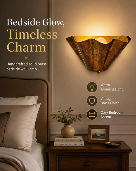 QUOLM Vintage Bronze Wall Sconce, Scalloped Uplight Wall Lamp, E26 in a cozy bedroom with warm ambient light.