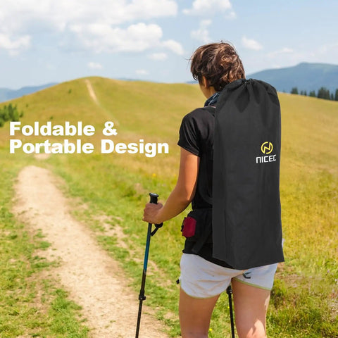 Person hiking with Comfy Hammock Chair With Canopy And Detachable Footrest in carry bag, highlighting foldable, portable design.