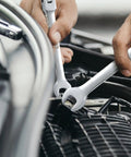 Close-up of Flex Head Ratcheting Wrench Set 14 Piece SAE Wrenches in use on automotive engine, chrome vanadium steel shown.