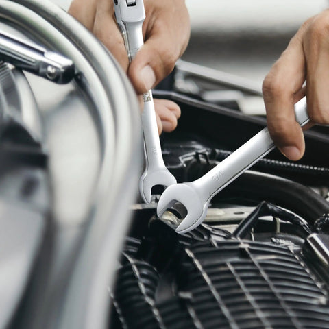 Close-up of Flex Head Ratcheting Wrench Set 14 Piece SAE Wrenches in use on automotive engine, chrome vanadium steel shown.