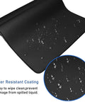 Ultra Large Extended Gaming Mouse Pad With Stitched Edges And Non Slip Natural Rubber Base For Esports Pros And Everyday Desk Setup, Waterproof Keyboard Mat Measuring 31.5 By 15.7 Inches, Pro Grade, Ideal For Gaming And Office with water-resistant surface close-up showing droplets