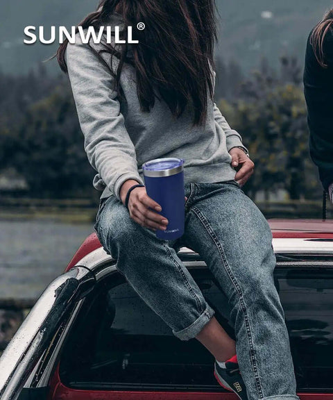 Person holding 20 Oz Travel Coffee Tumbler Insulated Stainless Steel Cup With Lid Keeps Drinks Hot For 6 Hours And Cold For 24 Hours