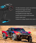 2.4G RC Radio System With 4CH Transmitter Receiver And Lanyard; Remote controller and RC truck driving through dirt