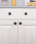 Oil Rubbed Bronze Cabinet Knobs Set 10 Pack One Point Four Inch Round Floral Design For Kitchen Cabinets And Drawers Antique Bronze Drawer Pulls With Smooth Operation And Durable Zinc Alloy Construction For Easy Mounting And Vintage Style Upgrade on a cabinet door