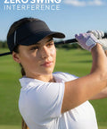 Woman playing golf wearing black sun visor hat for women and men, UV protection and breathable lightweight foldable outdoor headwear.