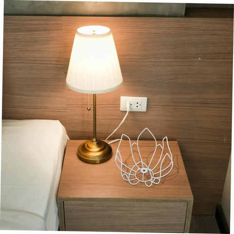 DIY Flower Wire Light Cage Frame For Pendant Lamps Built From Heavy Duty Iron on a nightstand beside a lamp.