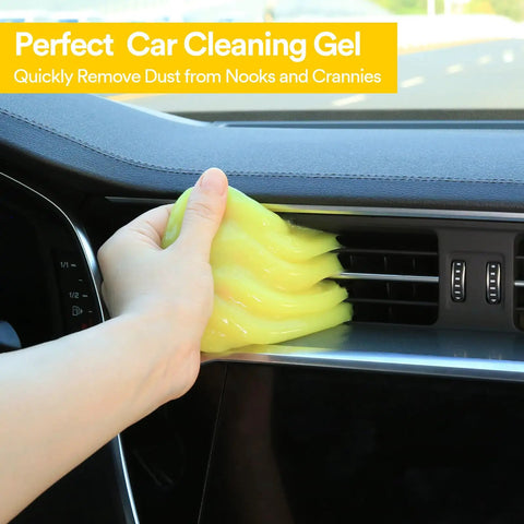 Hand using yellow Car Cleaning Gel For Detailing And Interior Cleaning on car vent, Flexible Cleaning Putty Slime That Grabs Dust From Cracks