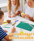 Family crafting with All In One Vinyl Weeding Toolkit For DIY Crafters, 33-Piece Set on table, green cutting mat visible