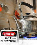 No Nonsense Aluminum Tent Warning Signs, Double Sided Heat Hazard Plates, 5 X 3.5 Inch with kettle and warning tag on stove.