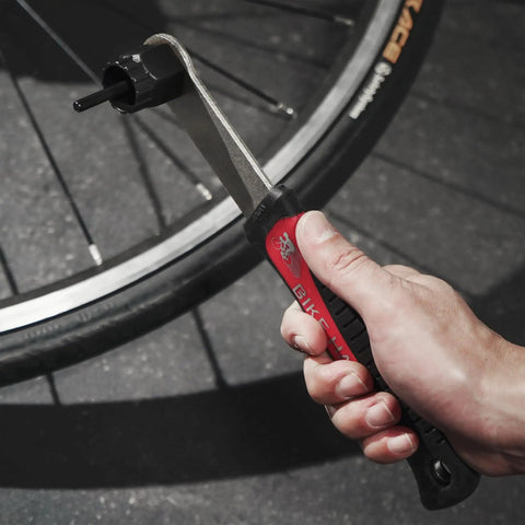 Close-up of hand using lockring tool from Two Tool Kit For Bike Cassette And Rotor Lockring With Chain Whip For Shimano SRAM And Center Lock Discs