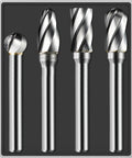 Four aluminum-cut carbide burrs with 1/4 in shanks, wide-flute cuts, in a storage tray