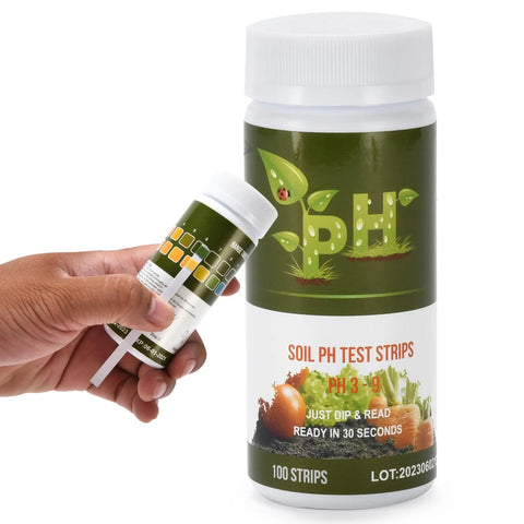 Hand holding Soil PH Test Kit Strip For Quick Accurate Garden Readings With Color Chart Easy To Use PH Tester For Gardens