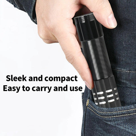 Person placing LED flashlight in pocket, showcasing 6 Pack LED Aluminum Mini USB C Rechargeable Handheld Flashlights for EDC