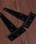 T Shape Door Hinges Set, 24 Pcs Black Iron Triangle Hinges with Six Screw Holes, displayed on wooden surface