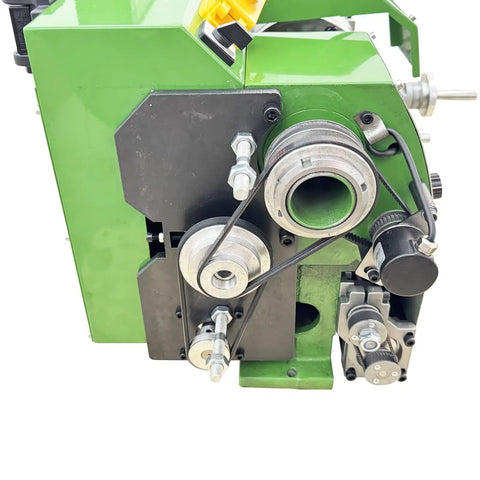 Close-up of precision metal lathe benchtop mini machine gear mechanism, showcasing electronic gear change and digital readout.