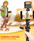 Do-It-All Travel Tripod Kit With One Quarter Inch Screw Adapter For Recording And Vlogging Includes Phone Clip Action Cam Adapter iPhone Vlogging Stand And 360 Degree Ball Head For Rock-Solid Flexible Shots showing handheld filming of a child on a skateboard
