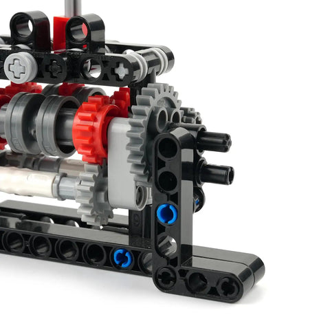Close-up of 4 Speed Gearbox DIY Transmission Kit for Power Functions Building Blocks showing gears and connection points.