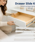 Woman opening white cabinet drawer showing Beefy Cold Rolled Steel Drawer Slide Kit 25 Cm Cabinet Track Rail with Thickened Hardware