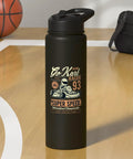 Black water bottle with 'Go Kart Racer 93' design on court, alongside basketball and gym bag.