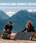 People setting up 100W Bifacial Portable Solar Panel For Explorer Power Stations Foldable Solar Charger in a scenic outdoor setting.