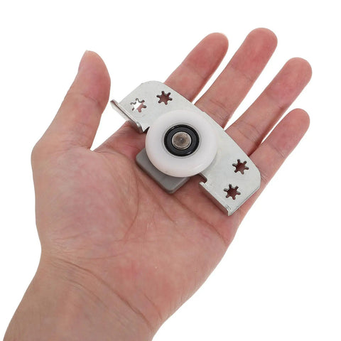 Heavy Duty Sliding Door Wheels For Cabinets And Closets 2 Pack Adjustable Iron Rollers in hand, showing durable white roller and metal part.