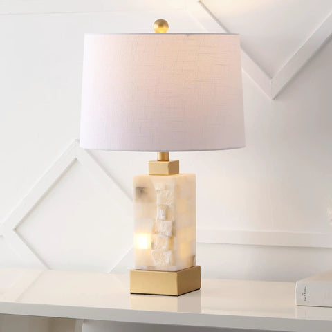 Coastal 23 Inch Gold And White Alabaster Rectangular Table Lamp With Night Light And White Linen Drum Shade on white surface