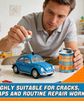 Person applying Heavy Duty Waterproof Super Glue Container With Built In Brush Applicator One Seventy Milliliter Size on model car.