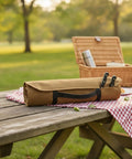 Canvas Knife Roll Bag With Handle For Travel And Camping on picnic table, 13 by 3.3 inches, tan with utensils, easy carry design