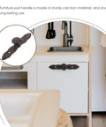 Vintage Cast Iron Drawer Pulls For Wardrobe And Cabinets, showing ornate design in black cast iron on kitchen cabinet