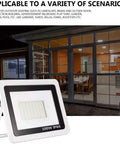 JUDYSSY Solar Flood Lights Led Floodlight 100W shown next to a modern glass door, ideal for outdoor lighting in various settings.