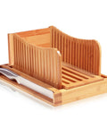 Dope Adjustable Bamboo Bread Slicer With Foldable Slicing Guide And Crumb Tray with knife shown on wooden tray