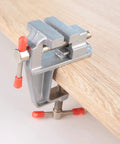 Mini Bench Vise With 36mm Opening And 34mm Table Thickness Clamp For Jewelry Making And DIY Repairs secured on wooden table