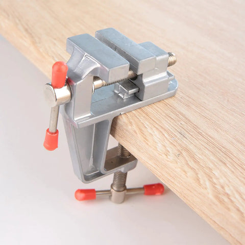 Mini Bench Vise With 36mm Opening And 34mm Table Thickness Clamp For Jewelry Making And DIY Repairs secured on wooden table