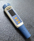 All In One 5 In 1 Water Quality Tester Handheld Digital Meter For pH TDS EC Salinity And Temperature on grey surface