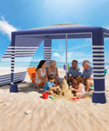 Group under Eight By Eight Foot Beach Cabana Tent With Sun Shield UPF 50 Plus Foldable Outdoor Canopy Detachable Side Wall on beach