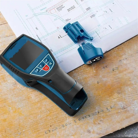 The Real Deal Digital Wall Scanner And Floor Detection Tool Finds Live Wires And Pipes With Dead Nuts Accuracy High Precision Stud Finder on wooden surface with blue accessories.