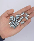 Forty Pack 1/4 20 Threaded Wood Inserts For Furniture Screw In Nuts 15mm Long Includes 1/4 Inch Allen Wrench Carbon Steel High Hardness For Long Lasting Hold shown on hand