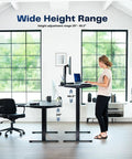 Woman using adjustable electric standing desk showing height range 29 to 48.2 inches. Upgrade Your Workspace With This Slick Dark Gray Standing Desk Measuring Sixty-Three By Thirty-Two Inches. The Adjustable Height Electric Sit Stand Workstation Offers A Spacious Three-Piece Desktop For Monitor Setups And More. Perfect For Home Offices Or.