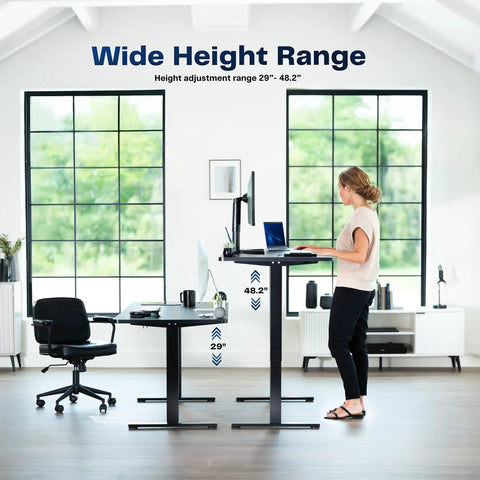 Woman using adjustable electric standing desk showing height range 29 to 48.2 inches. Upgrade Your Workspace With This Slick Dark Gray Standing Desk Measuring Sixty-Three By Thirty-Two Inches. The Adjustable Height Electric Sit Stand Workstation Offers A Spacious Three-Piece Desktop For Monitor Setups And More. Perfect For Home Offices Or.