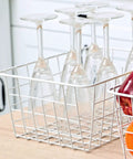 Set Of 4 White Wire Storage Baskets For Freezer, Pantry, And Bathroom Organization with glassware and fruits on a counter