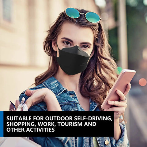 Woman wearing KN95 Face Masks 50 Pack for Adults and Teens, Disposable Black Masks With Breathable Comfort outdoors