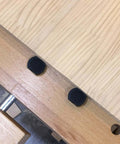Beefy Pro Grade Bench Dogs for 19mm or 20mm dog holes shown in wood surface close-up