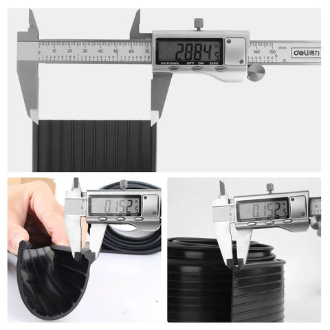 Replacement Wayne Dalton garage door bottom weather seal, black rubber, 16 ft length, shown with calipers.