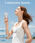 Woman using Bladeless Mini Portable Fan With Safe Design Turbo Handheld Breeze 5 Speed Modes USB Rechargeable Up To 16 Hours Cool Time Pocket Sized Travel Buddy Perfect Gift For Women And Girls