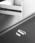 White drawer with components of Five Sets Invisible Childproof Cabinet Locks No Tools Needed Strong Adhesive Drawer Locks