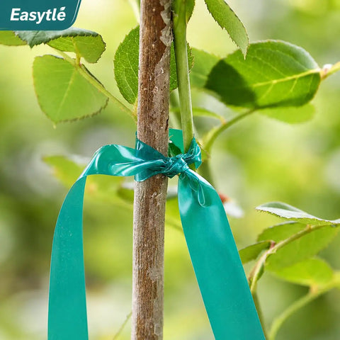 Built Tough Garden Tie Tape Roll Half Inch Wide 300 Feet Long Green Vinyl Plant Support Ribbon For Indoor Outdoor Garden Stakes And Plant Training Fade Resistant Stretchable securing a plant to a stake.